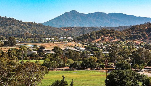 Aerial view of McInnis Park with mountains in background